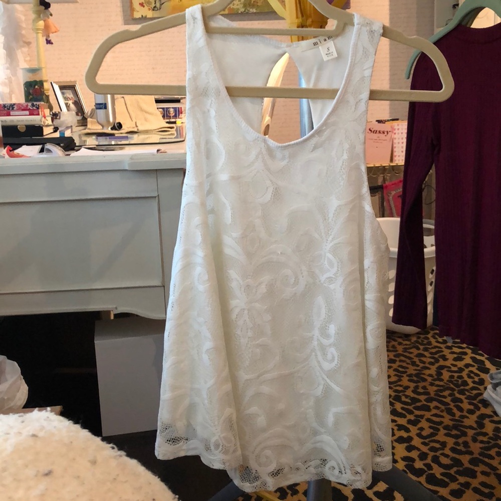 White tank with oval cut out in back